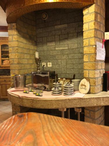 a kitchen with a counter with dishes on it at Hotel City in Täsch