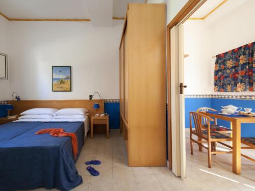 Cama o camas de una habitación en Villaggio Albergo Internazionale La Plaja