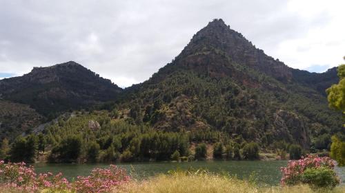 a mountain range with a lake in front of it at Casa Encina - Encinasola Turismo Rural. in Alora