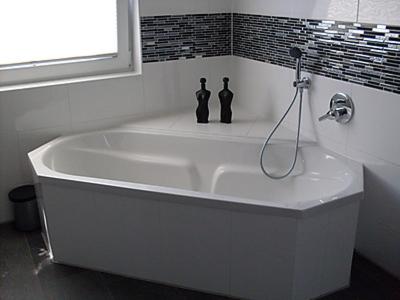 a white bath tub in a bathroom with a window at Seefelder Urlaubsparadies in Seefeld