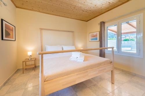מיטה או מיטות בחדר ב-Amygdalia Villa