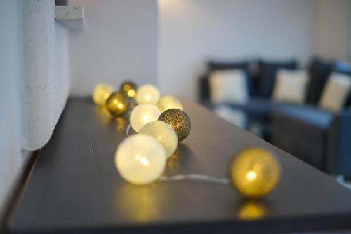 a group of yellow spheres sitting on top of a table at Apartments Aurora in Zadar