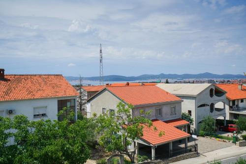 a group of houses with orange roofs at Apartments Aurora in Zadar