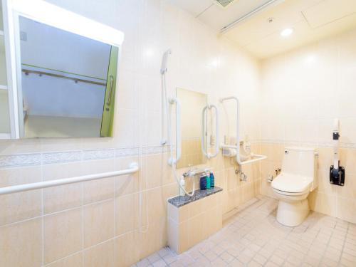 a bathroom with a toilet and a shower and a sink at Hotel Abest Naha Kokusai Street in Naha