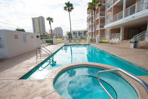 a swimming pool in the middle of a building at Grand Beach Resort Penthouse 1 in Gulf Shores