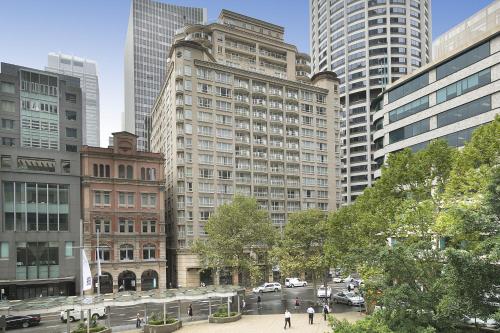 a city with tall buildings and a street with people at Bond 1218 Self Catering in Sydney