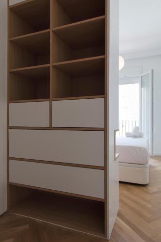 a bedroom with a built in book shelf at FLORIT FLATS - Chic and Central in a lively but quiet area All walking distance in Valencia