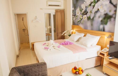 Ένα ή περισσότερα κρεβάτια σε δωμάτιο στο Deva Bali Apartement