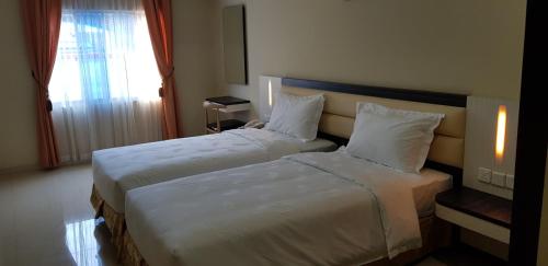 Postel nebo postele na pokoji v ubytování SP hotel