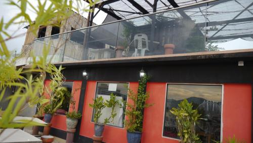 a building with plants on the side of it at Abby by the river in Ipoh