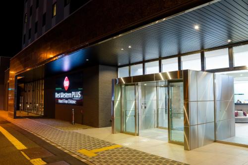 an entrance to a building with a revolving door at Best Western Plus Hotel Fino Chitose in Chitose