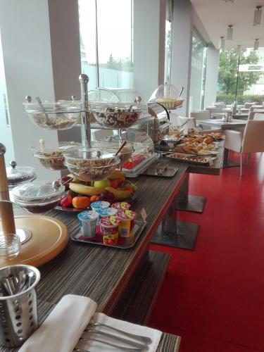 a buffet line with many different types of food at Hotel Olympia in Kopřivnice