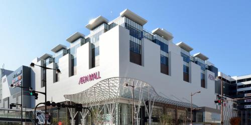 a rendering of the front of a building at Lazy House in Okayama