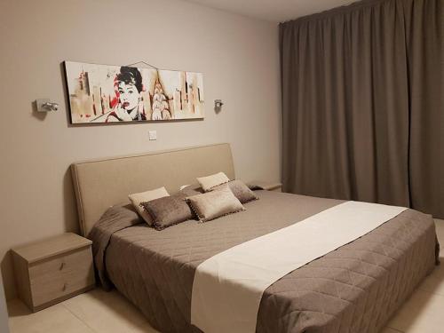 a bedroom with a large bed in a room at Marianna Hotel Apartments in Limassol