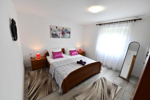 Postel nebo postele na pokoji v ubytování Holiday home Miramary