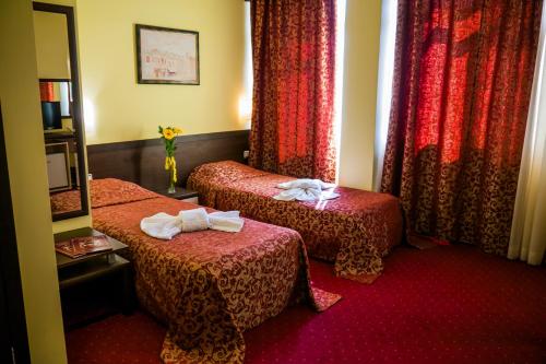 Postel nebo postele na pokoji v ubytování Hotel Kabile