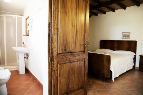 Ένα ή περισσότερα κρεβάτια σε δωμάτιο στο Agriturismo la Gioia