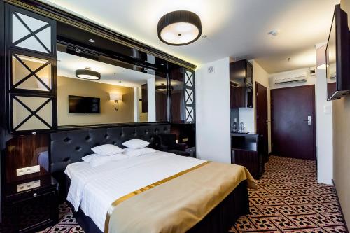 Ένα ή περισσότερα κρεβάτια σε δωμάτιο στο Hotel 500 Premium