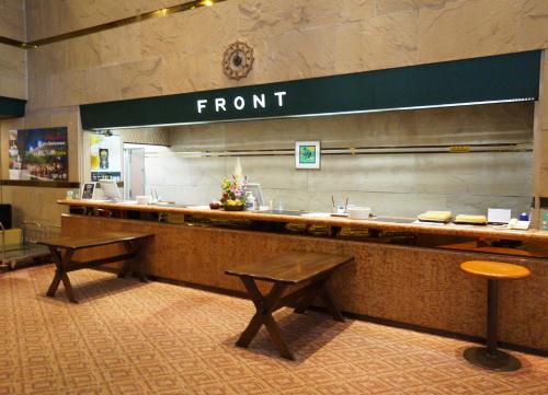 a front counter of a restaurant with two benches at Gotemba Kogen Tokinosumika in Gotemba