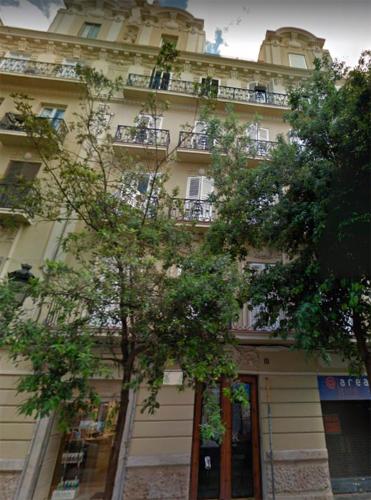 a tall building with trees in front of it at FLORIT FLATS - Chic and Central in a lively but quiet area All walking distance in Valencia