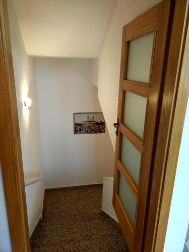 a door leading into a room with a staircase at Guest House Regina Mundi in Međugorje