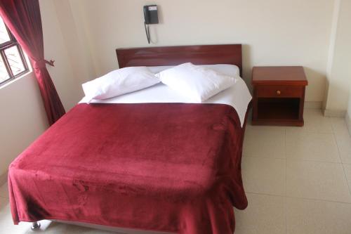 Una cama o camas en una habitación de Hotel Vigua