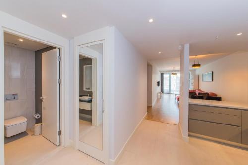 an open hallway with a bathroom and a living room at Classy Suite Taksim in Istanbul