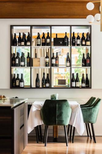 a room with a display of bottles of wine at Anett hotel in Vipiteno