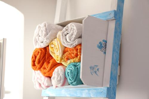 a pile of towels sitting on a shelf at Mimi in Jadranovo