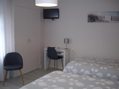 Ένα ή περισσότερα κρεβάτια σε δωμάτιο στο Hôtel Restaurant Anglade