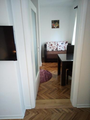 a living room with a couch and a table at Apartment Holiday in Vrnjačka Banja