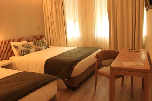 Katil atau katil-katil dalam bilik di Fátima GuestHouse