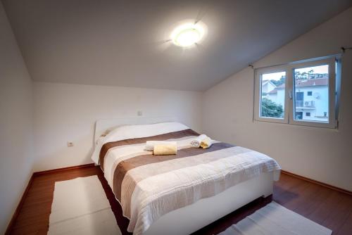 Apartman NANEにあるベッド