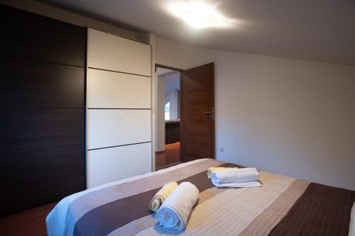 Postel nebo postele na pokoji v ubytování Apartman NANE