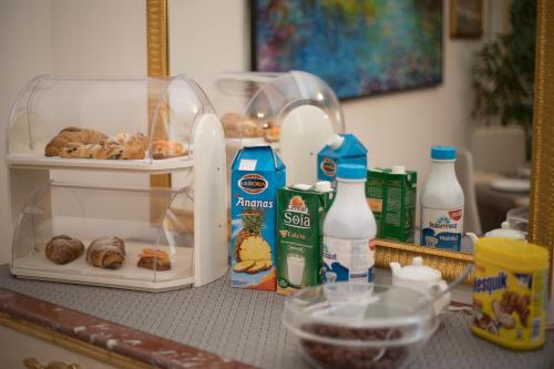 a counter with food and milk on it at Cannatella's Mansion in Palermo