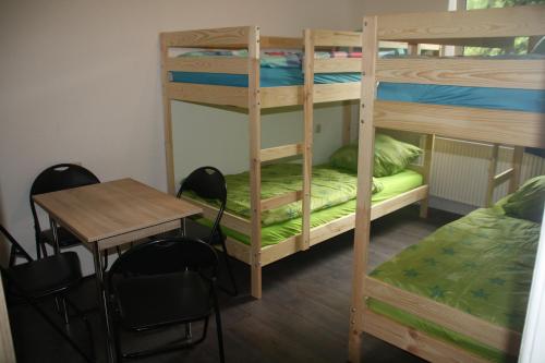 Μία ή περισσότερες κουκέτες σε δωμάτιο στο Apartmenthaus am Rennplatz