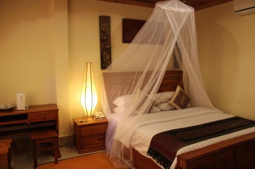 Ένα ή περισσότερα κρεβάτια σε δωμάτιο στο Shining Angkor Apartment Hotel