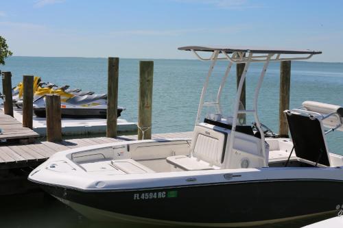a boat is docked at a dock on the water at Gilbert's Resort in Key Largo