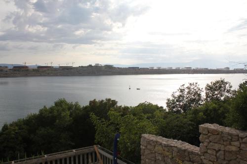 a view of a river with a bridge in the distance at Primavera in Omišalj
