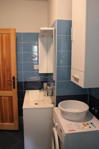 a bathroom with a sink and a toilet in it at Primavera in Omišalj