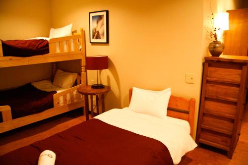 Ένα ή περισσότερα κρεβάτια σε δωμάτιο στο Morino Lodge - Hakuba