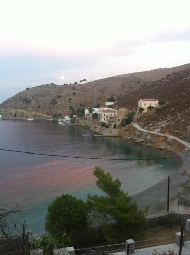 a view of a body of water with houses at Panorama Thea in Symi