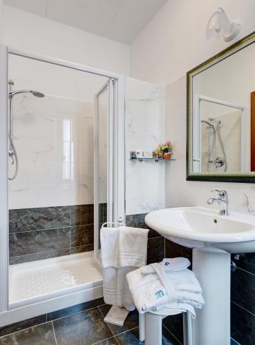 a bathroom with a sink and a shower at Hotel Residenza In Farnese in Rome