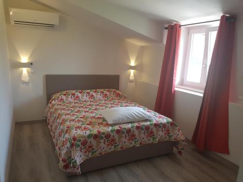A bed or beds in a room at B&B MOLINARI