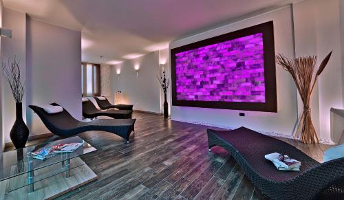 Телевизор и/или развлекательный центр в Hotel Terme Belsoggiorno