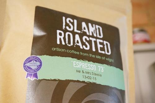 a sign that reads island roastediction coffee from the end of town at shoreside inn in Shanklin
