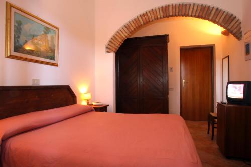 Postel nebo postele na pokoji v ubytování Hotel Residence I Briganti di Capalbio