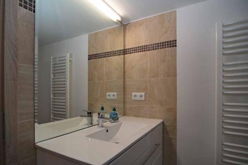 a bathroom with a sink and a mirror at Pferdehof Berger in Penig