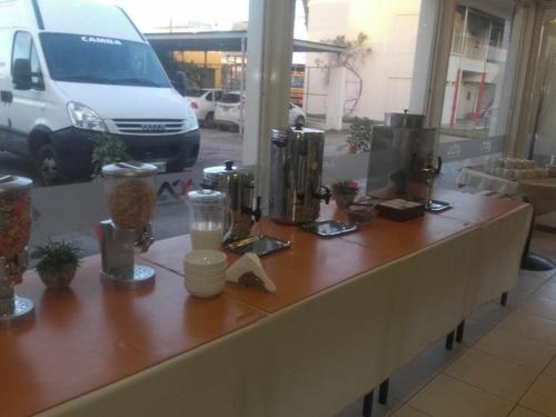 a counter in a store with a van in the background at Hotel ACA Santa Rosa in Santa Rosa