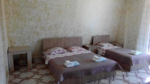 Postel nebo postele na pokoji v ubytování Guest House Vitali